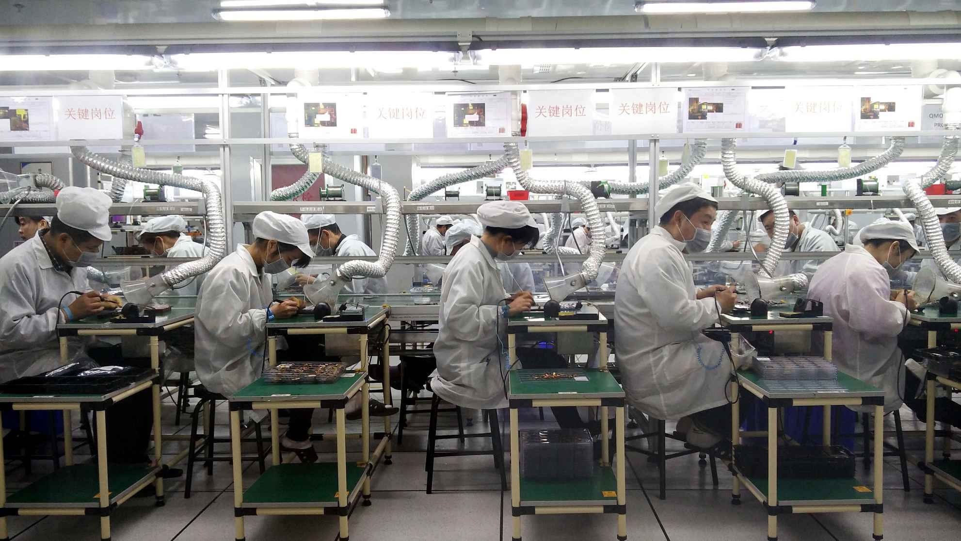 Workers at a semiconductor factory